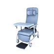 Luxurious cushioned geriatric homecare chair with extended legrest and recliner backrest on a white background. Meal tray in front.